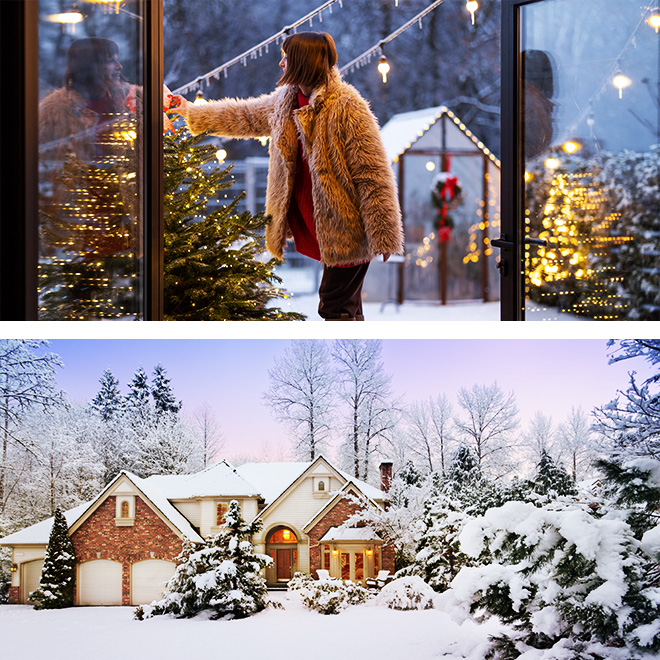 Big two story white house covered in snow surrounded by pine trees.